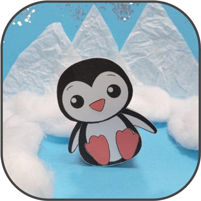 Paper snowy winter scene with penguin figure