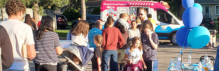 Patrons lined up to get ice cream from a truck