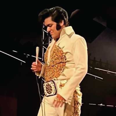 Hugo Colin in costume as Elvis Presley