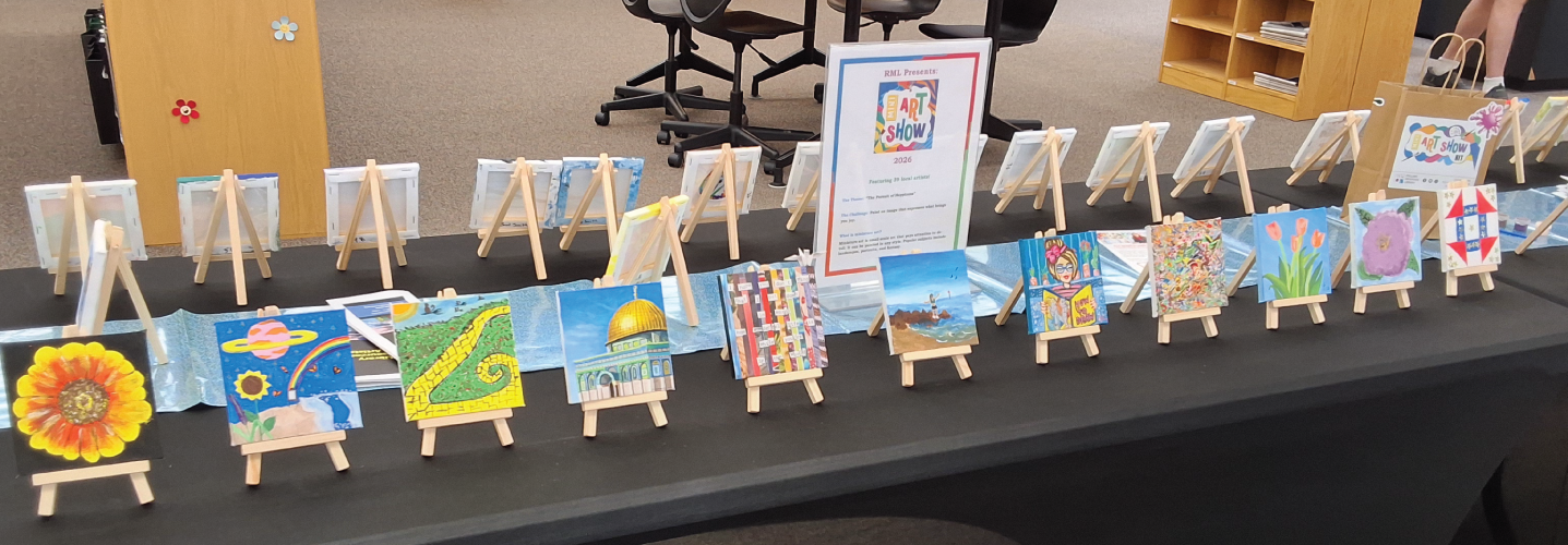 Table full of mini canvases on display