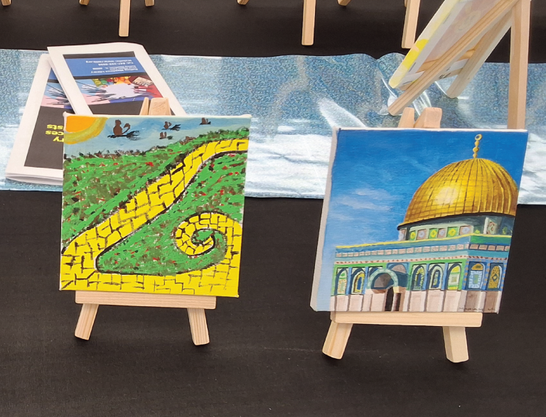 Painting of yellow brick road and painting of mosque