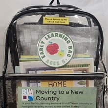 clear back bag filled with books and activities