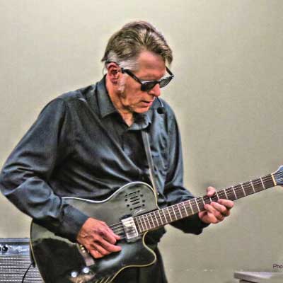 Randy Walker playing guitar